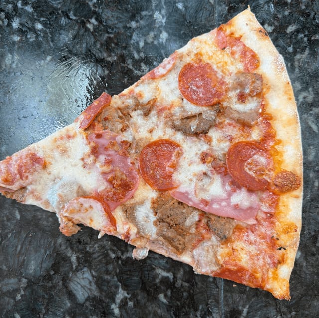 Meat Lovers Pizza Slice.