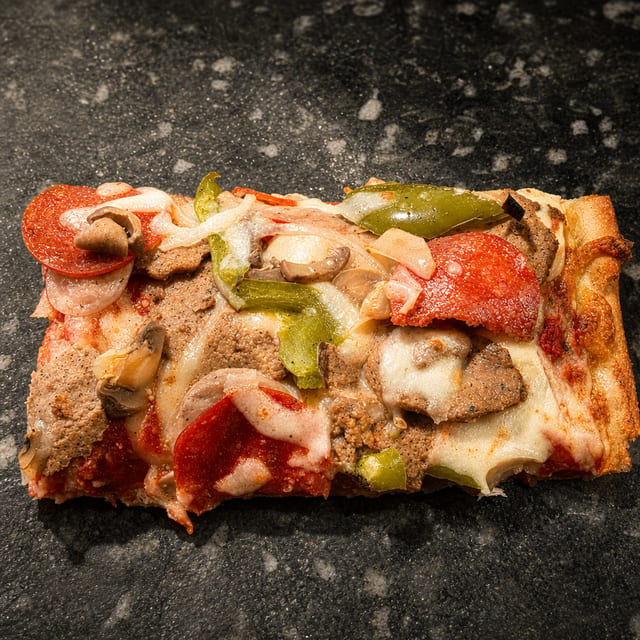 Sicilian Everything Pizza Slice.